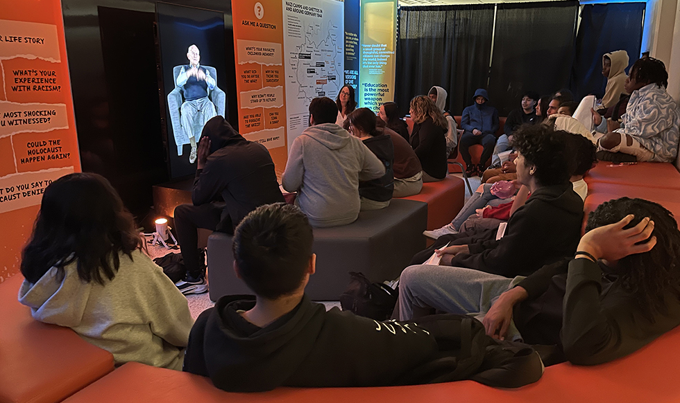 Students at White Plains High School learn about the Holocaust in the Dimensions in Testimony room of the We Are White Plains exhibit